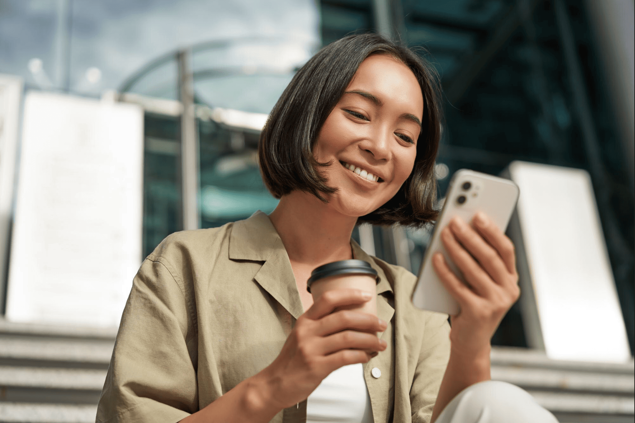 Smiling woman looking at phone